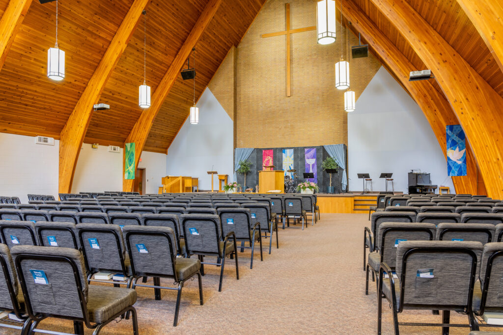 Interior of the Aylmer CRC sanctuary with its wooden peaked ceiling and cross