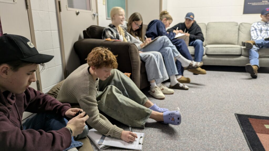 Small group meeting on couches in a lounge