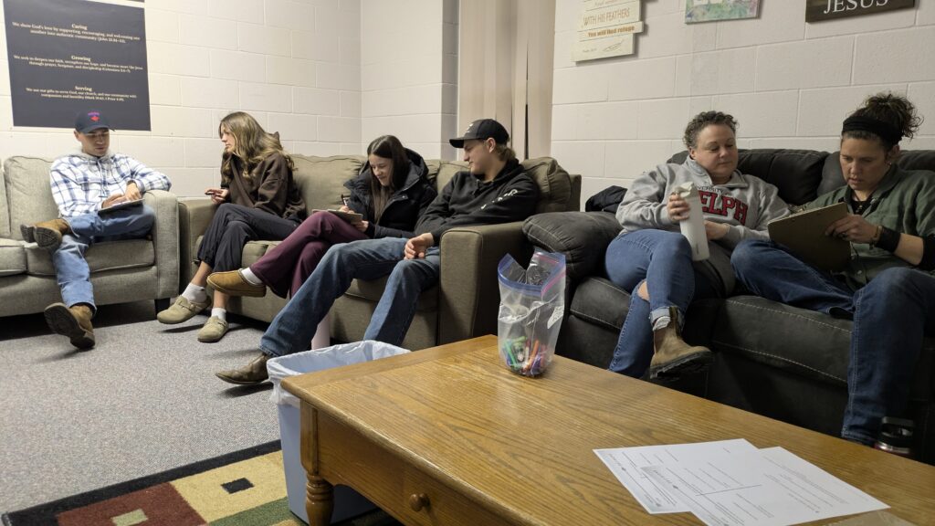 Small group gathered on couches for fellowship